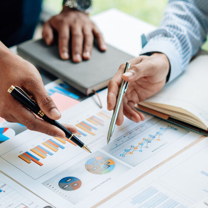business team pointing at graph